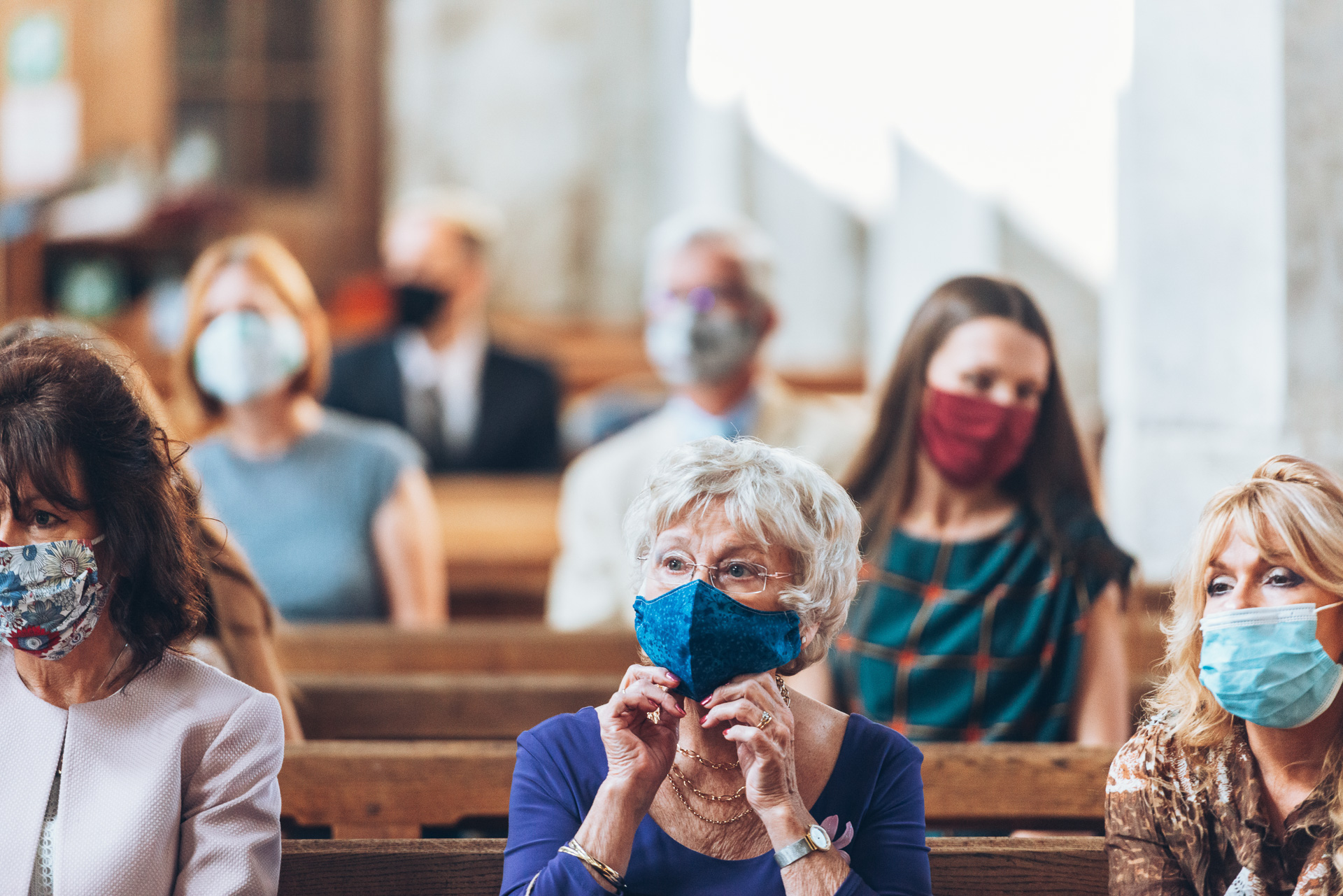 Guests wearing a mask during a service