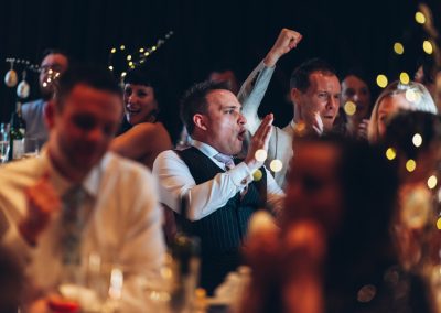 Man cheering at a wedding